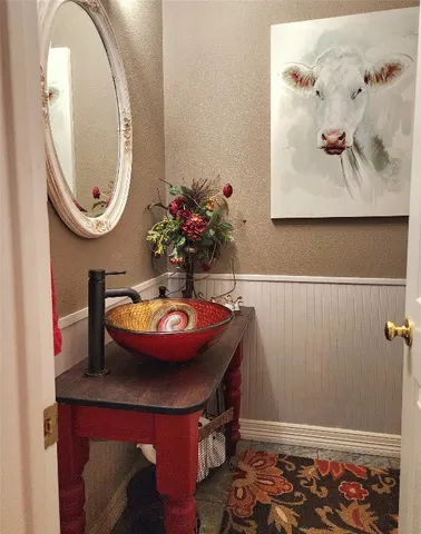 a room with furniture and mirror