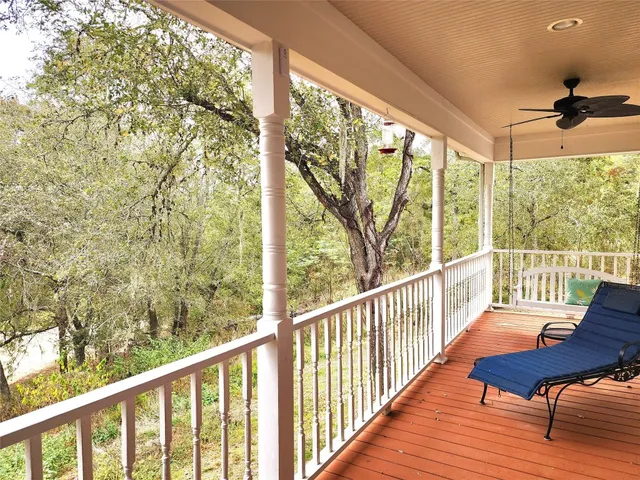 a view of a two chairs in the balcony