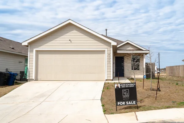 a front view of a house with garage