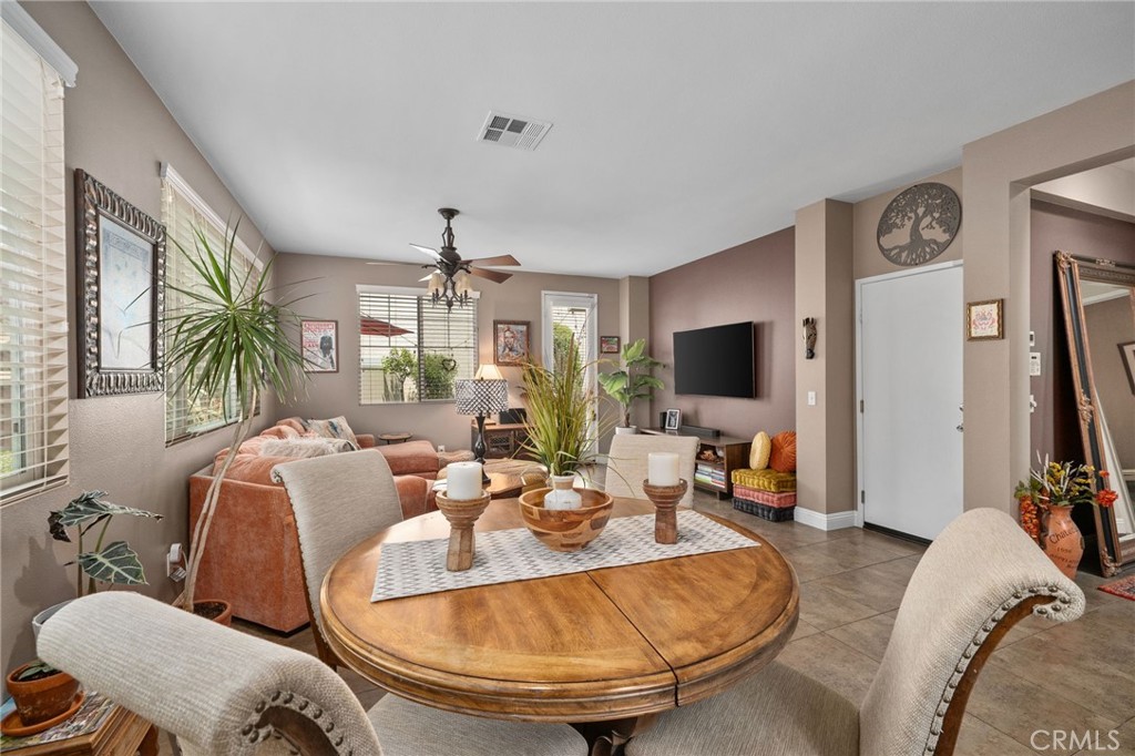 33942 Telstar Road Yucaipa, CA 92399 - Photo 11 of 40 a living room with furniture and a flat screen tv