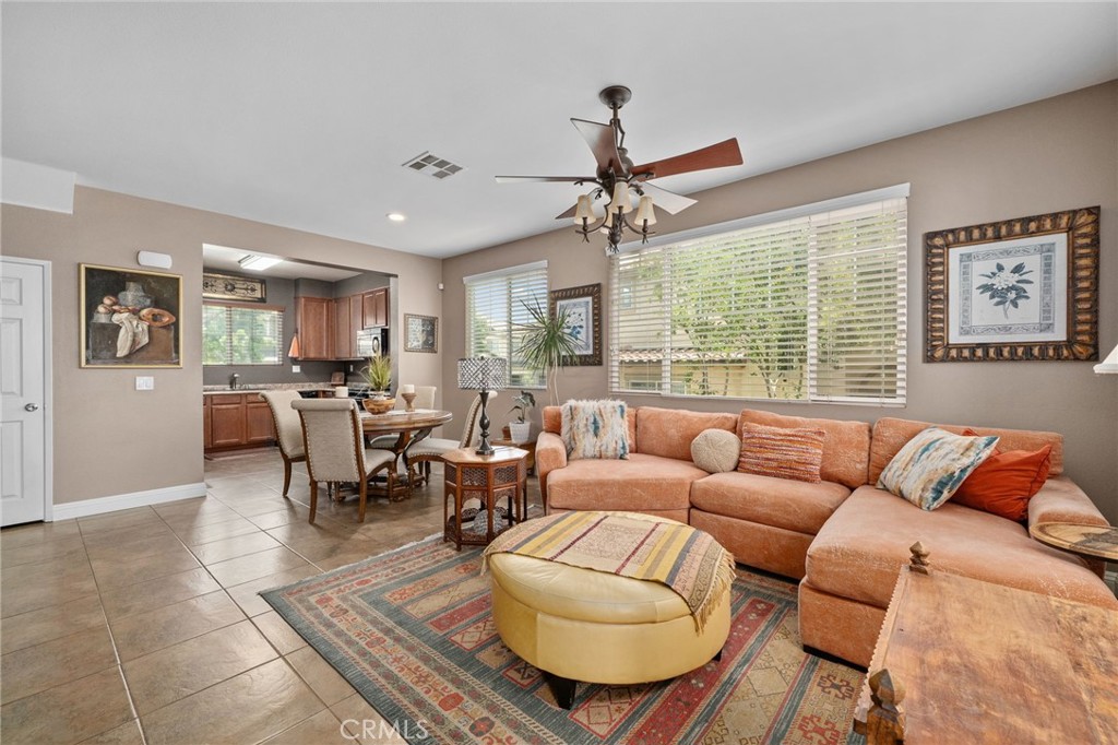33942 Telstar Road Yucaipa, CA 92399 - Photo 12 of 40 a living room with furniture and a large window