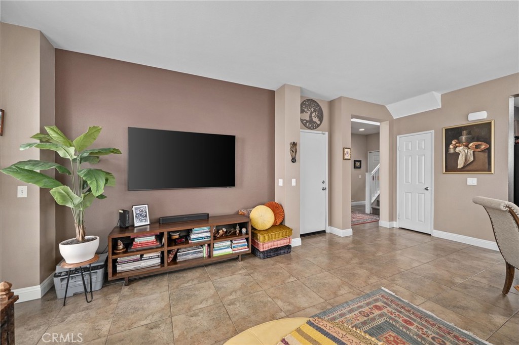 33942 Telstar Road Yucaipa, CA 92399 - Photo 13 of 40 a living room with furniture and a flat screen tv
