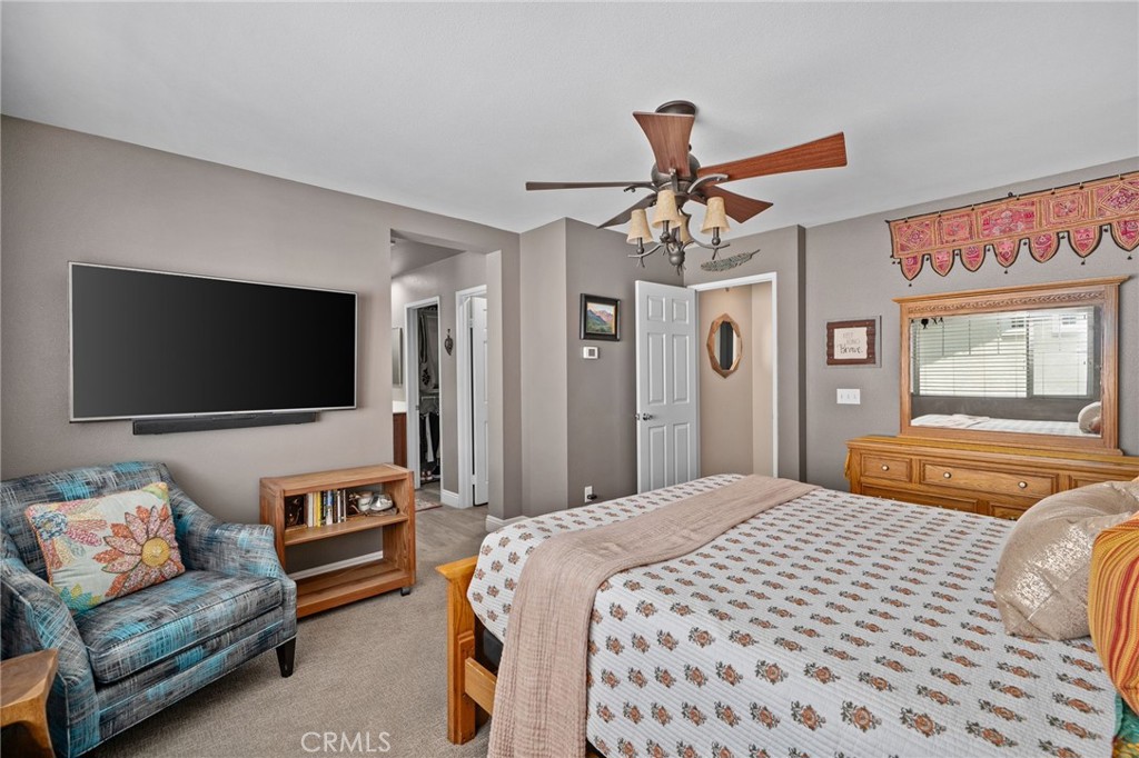 33942 Telstar Road Yucaipa, CA 92399 - Photo 19 of 40 a bedroom with a bed and a flat screen tv