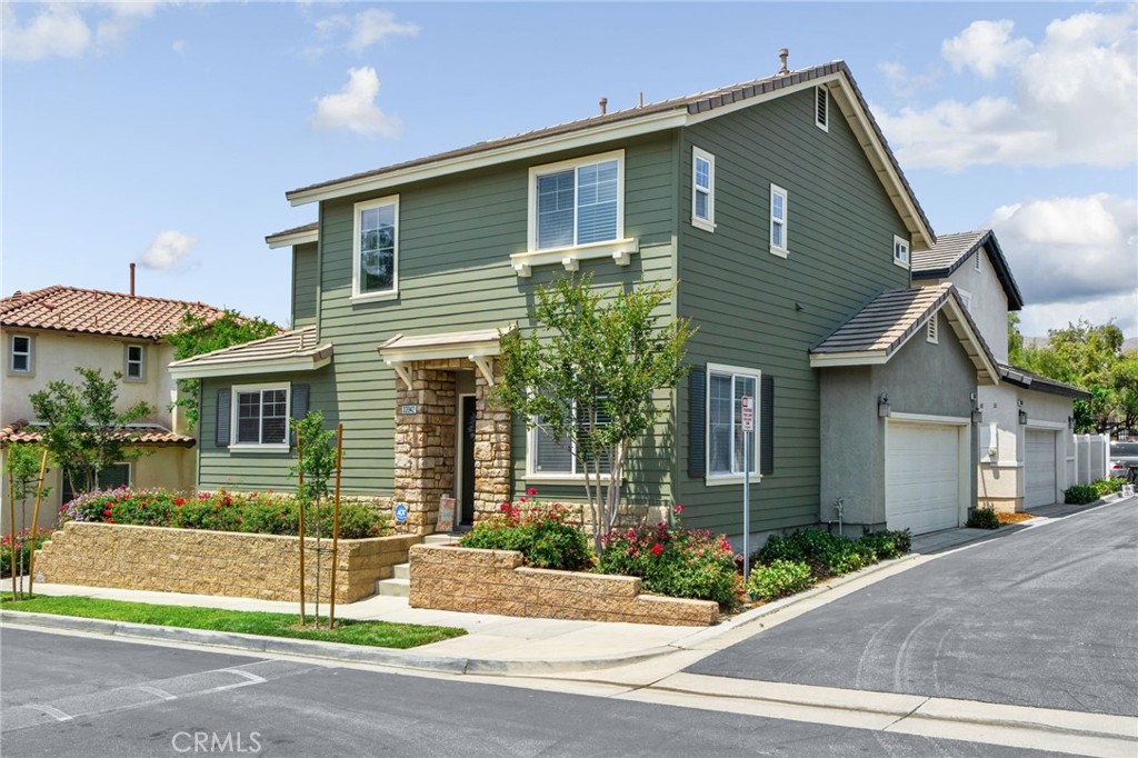 33942 Telstar Road Yucaipa, CA 92399 - Photo 2 of 40 a front view of a house with a yard and garage