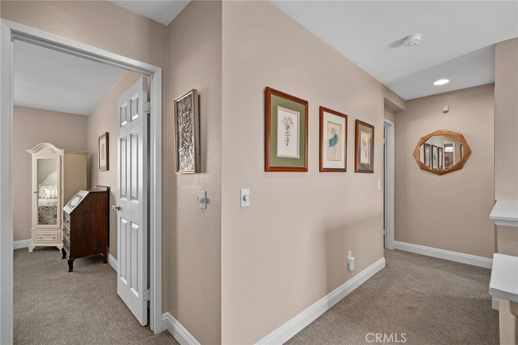 33942 Telstar Road Yucaipa, CA 92399 - Photo 24 of 40 a view of a hallway with closet and a livingroom
