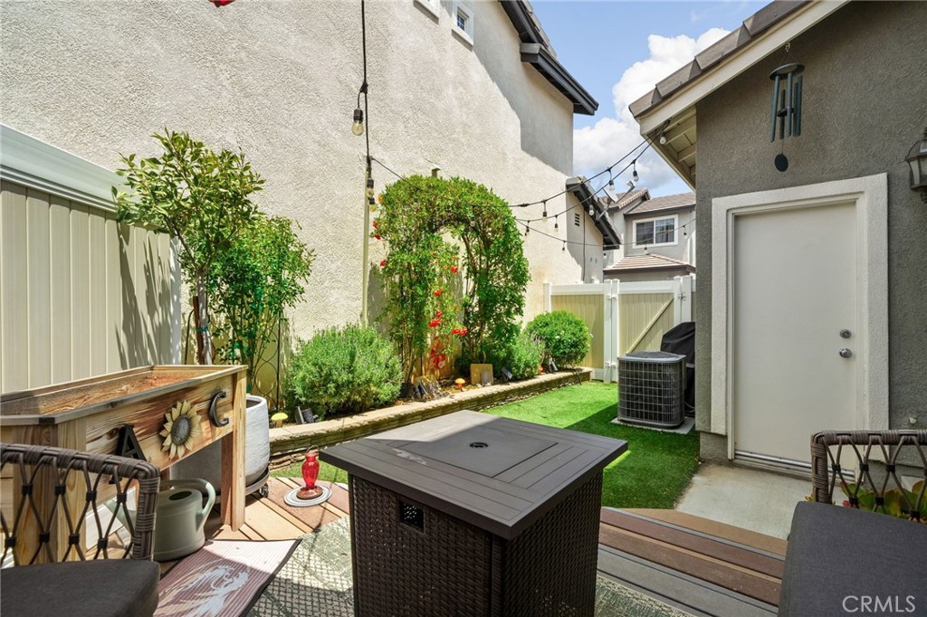 33942 Telstar Road Yucaipa, CA 92399 - Photo 30 of 40 a view of a patio with table and chairs and potted plants