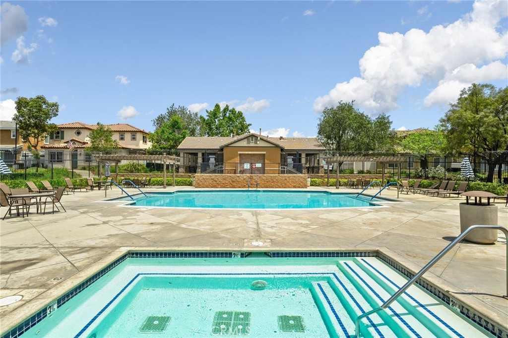 33942 Telstar Road Yucaipa, CA 92399 - Photo 34 of 40 a view of swimming pool with outdoor seating and a patio