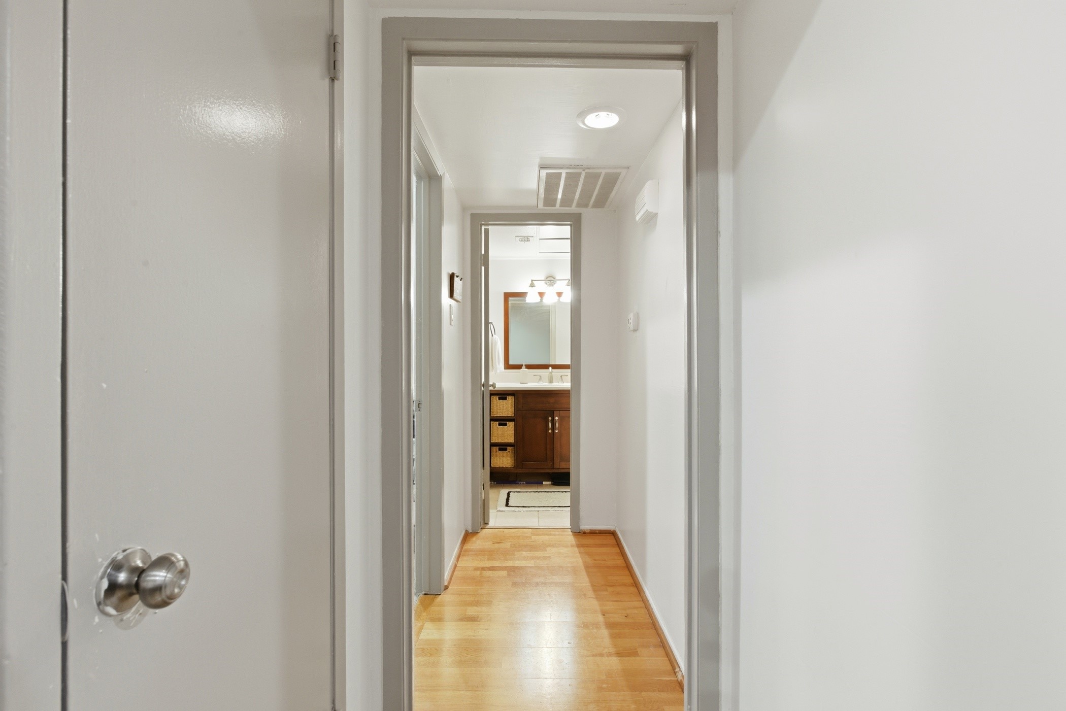 2224 South Piney Point Road, Unit 222 Houston, TX 77063 - Photo 18 of 28 a view of a hallway with wooden shelves
