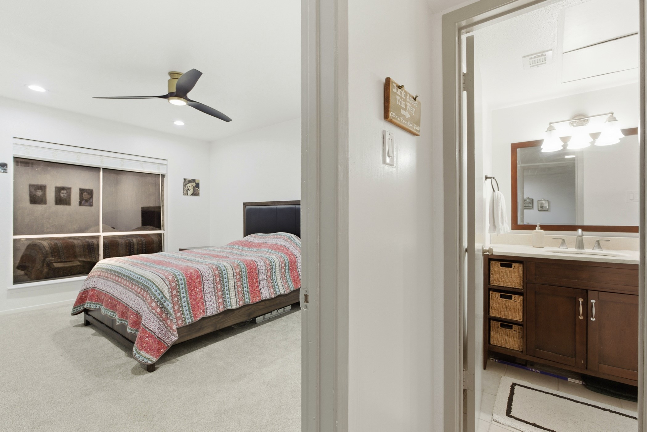 2224 South Piney Point Road, Unit 222 Houston, TX 77063 - Photo 19 of 28 a bedroom with a bed and dresser with mirror