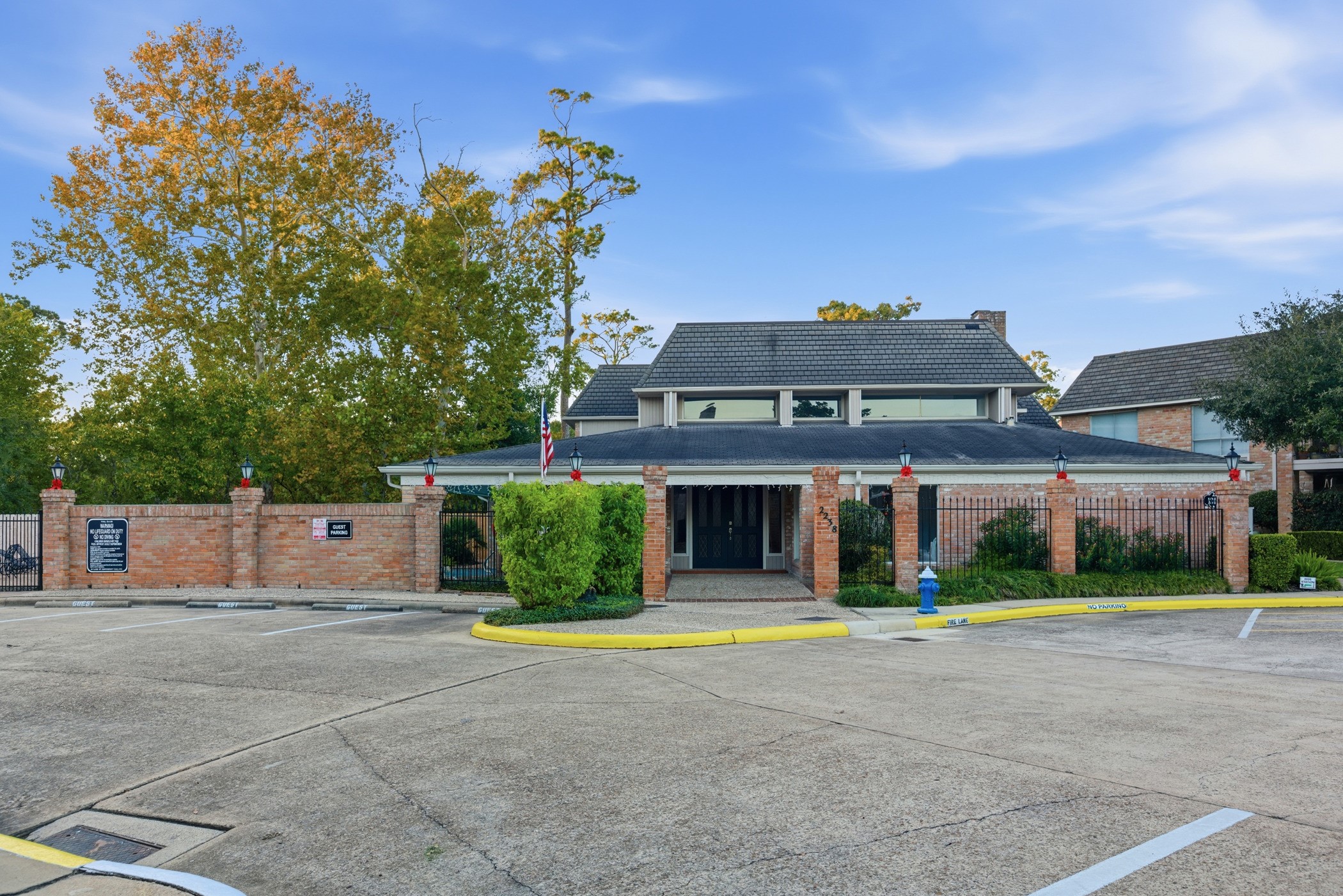 2224 South Piney Point Road, Unit 222 Houston, TX 77063 - Photo 2 of 28 a front view of a house with a yard