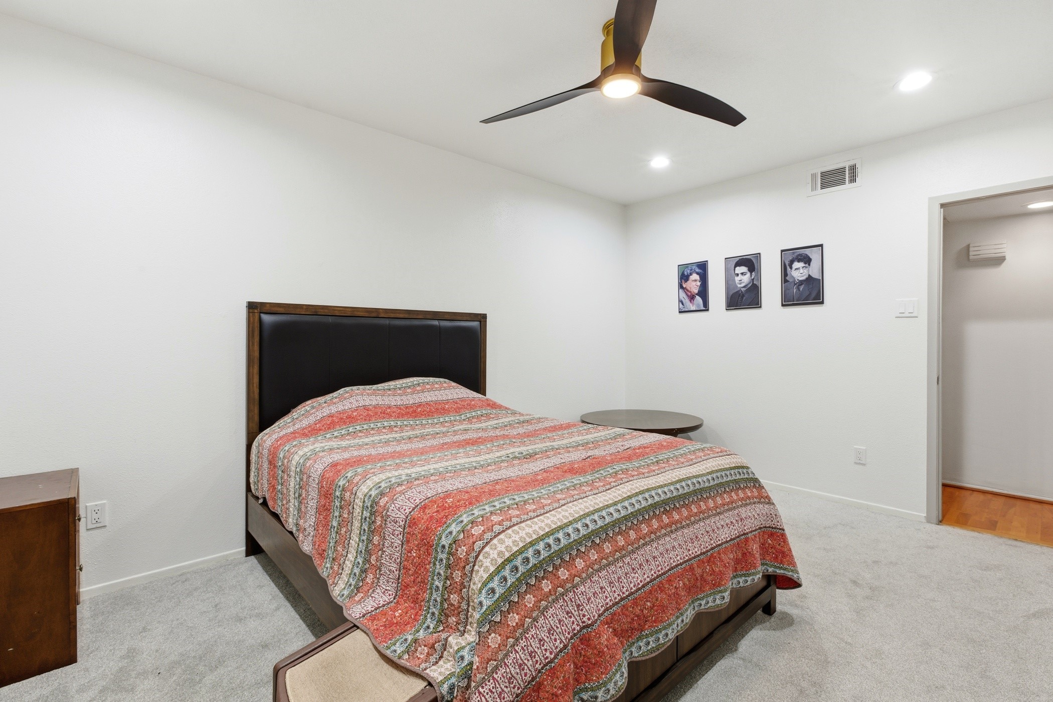 2224 South Piney Point Road, Unit 222 Houston, TX 77063 - Photo 22 of 28 a bedroom with a bed and a painting on the wall