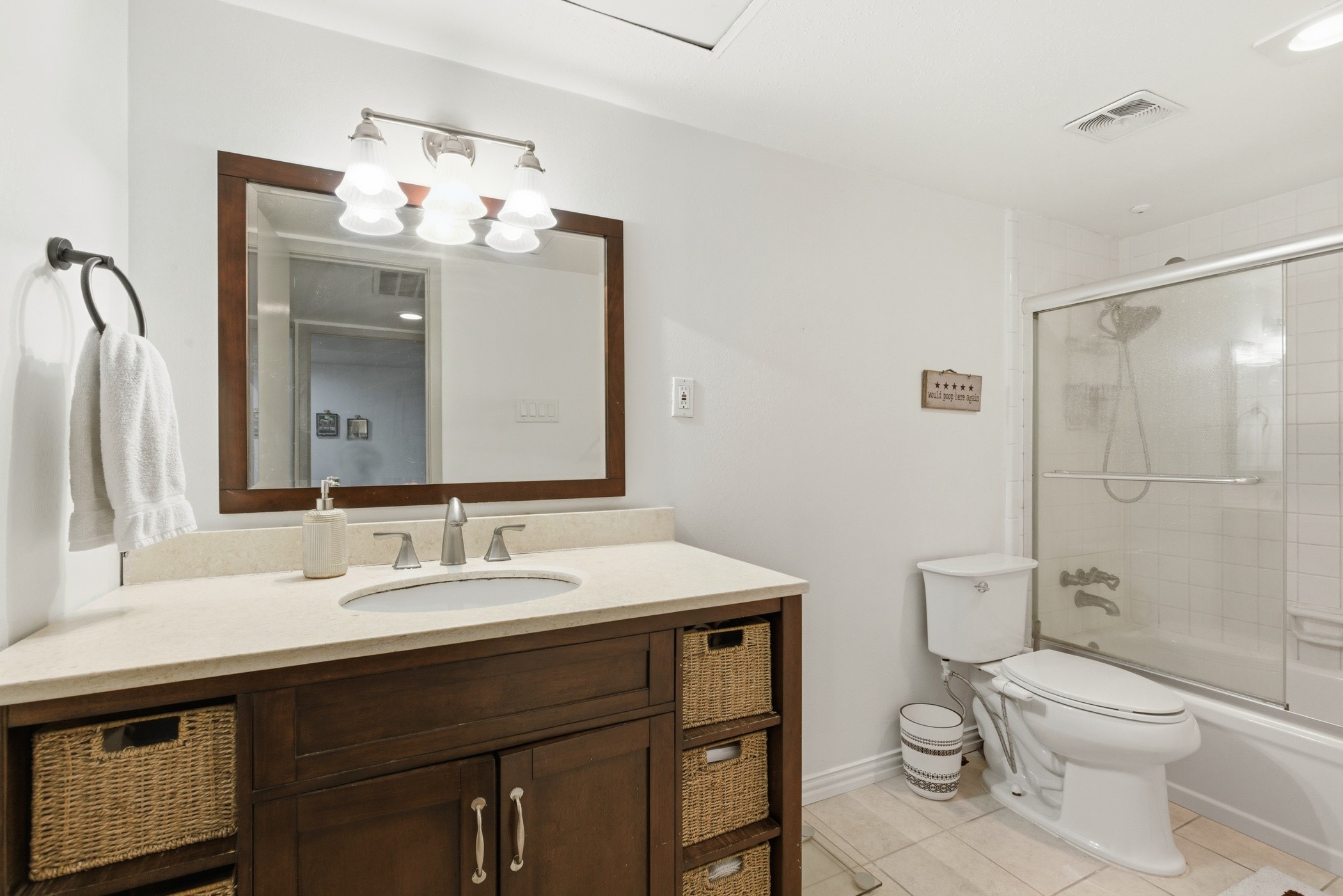 2224 South Piney Point Road, Unit 222 Houston, TX 77063 - Photo 23 of 28 a bathroom with a sink vanity mirror and toilet
