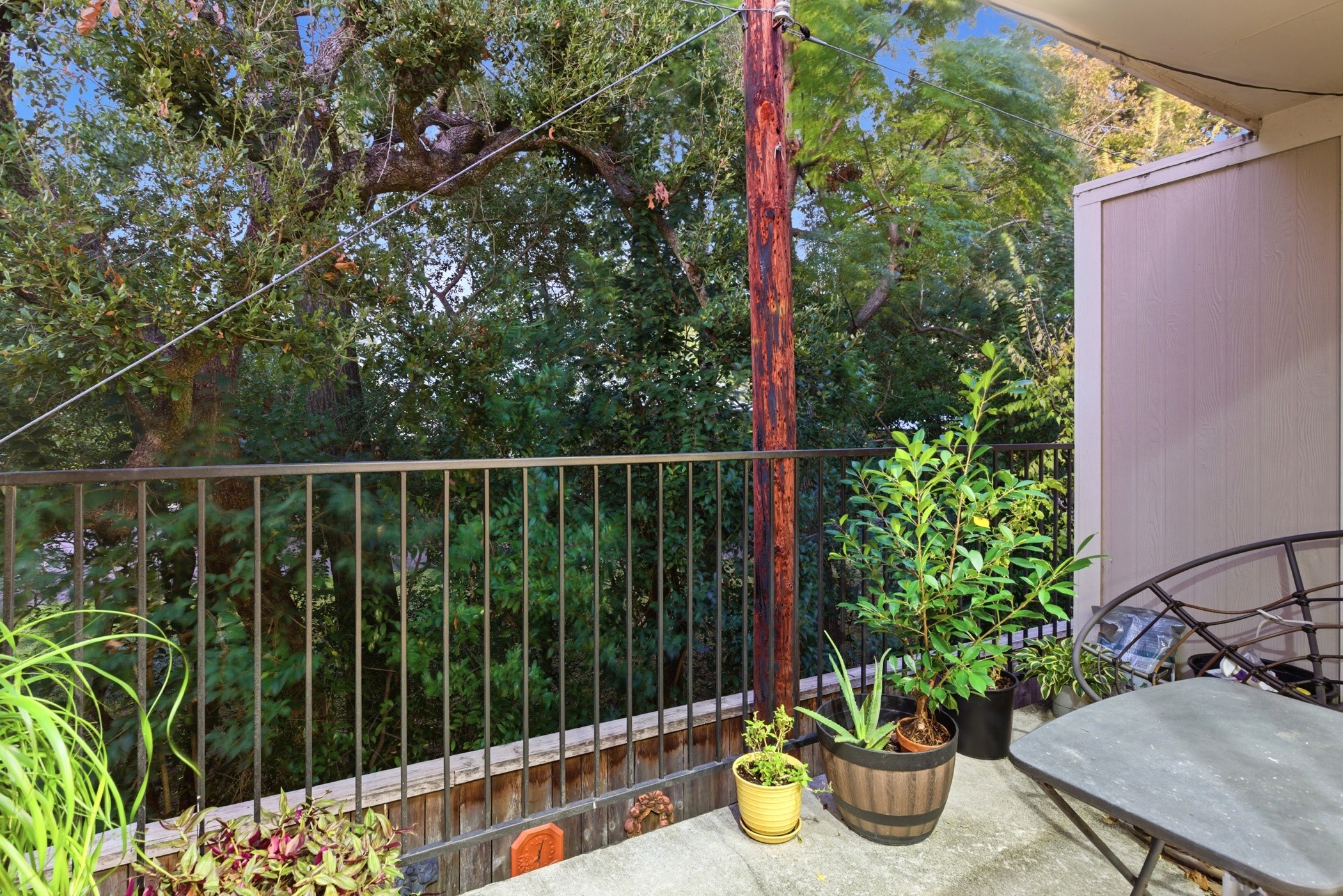 2224 South Piney Point Road, Unit 222 Houston, TX 77063 - Photo 25 of 28 a view of a balcony with chair potted plants