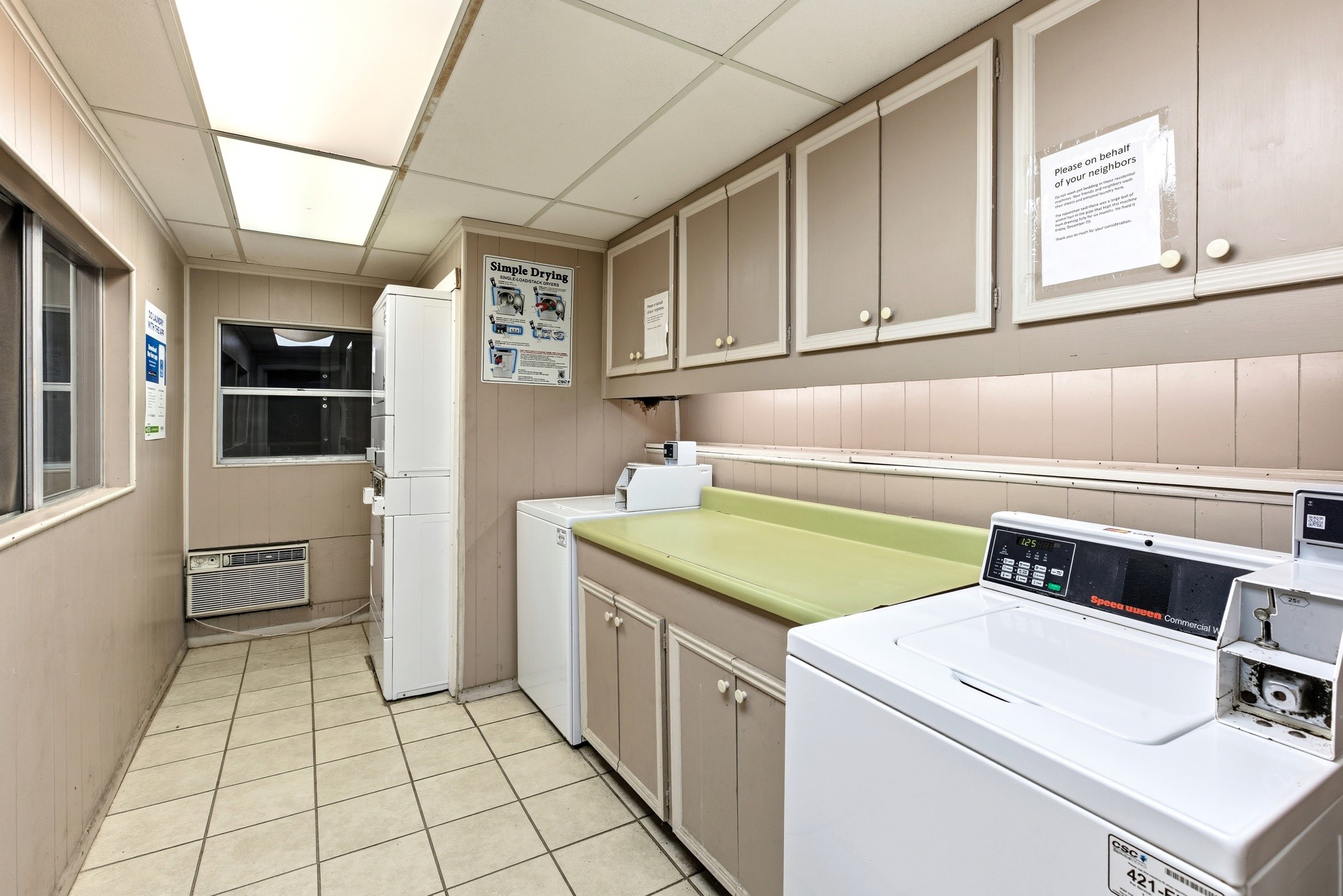 2224 South Piney Point Road, Unit 222 Houston, TX 77063 - Photo 27 of 28 a utility room with washer and dryer