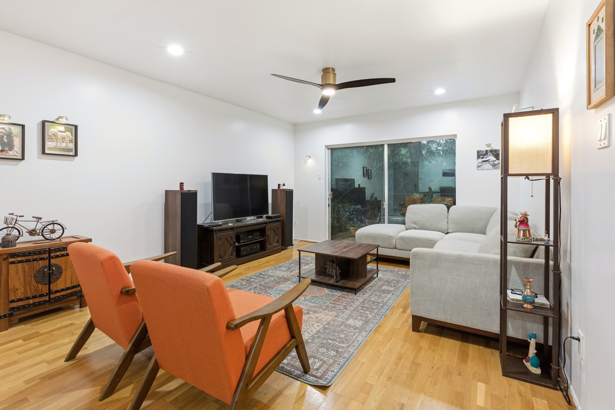 2224 South Piney Point Road, Unit 222 Houston, TX 77063 - Photo 8 of 28 a living room with furniture a flat screen tv and a large window