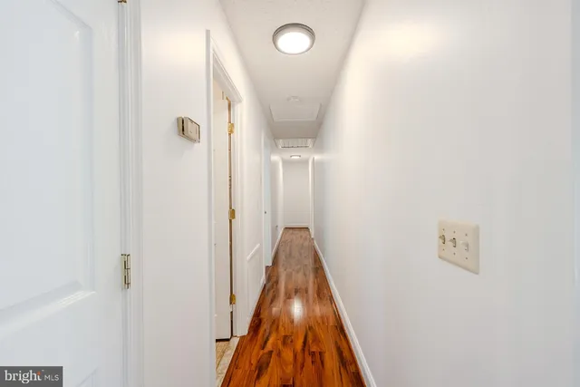 a view of a hallway with a room