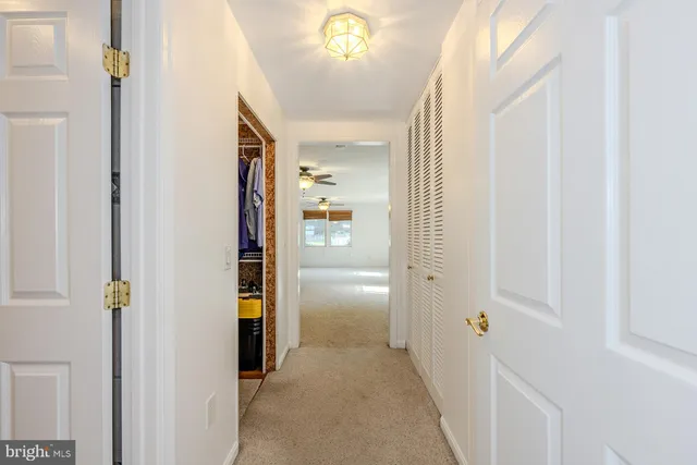 a view of hallway with livingroom