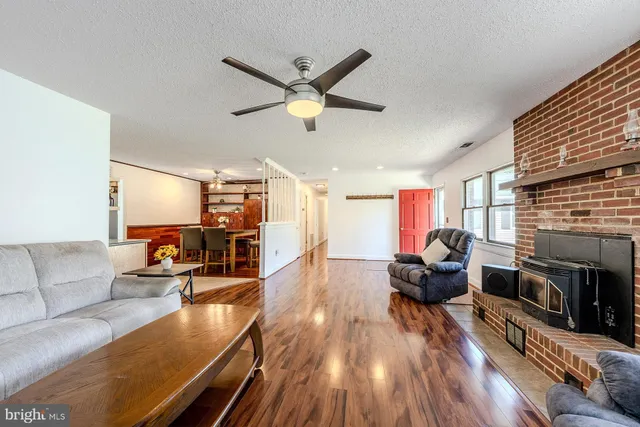 a living room with furniture and a fireplace