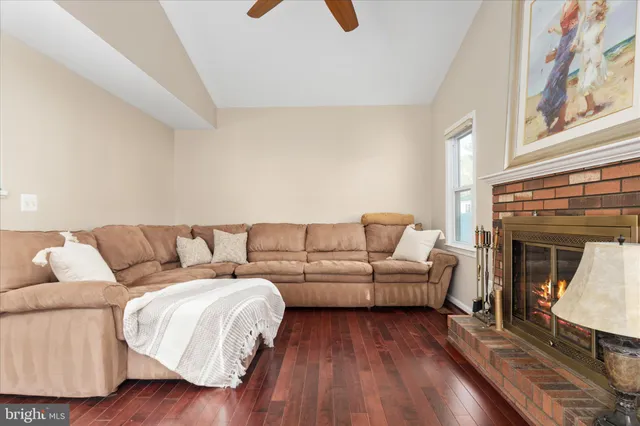 a living room with a couch and a fireplace