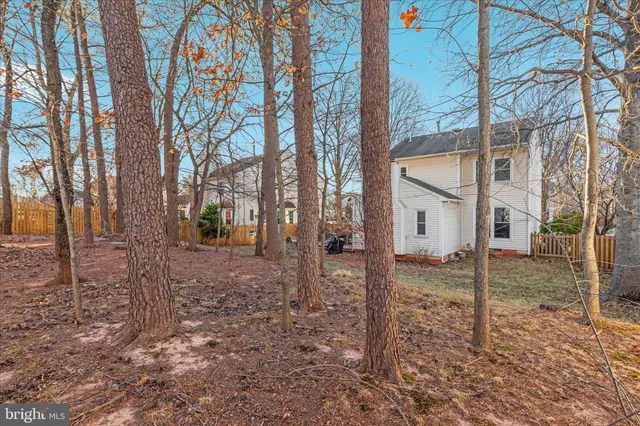 a front view of a building with trees