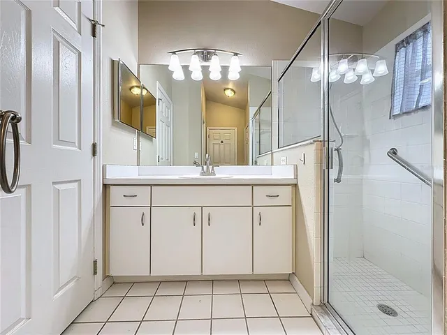 a view of an empty room and wooden floor