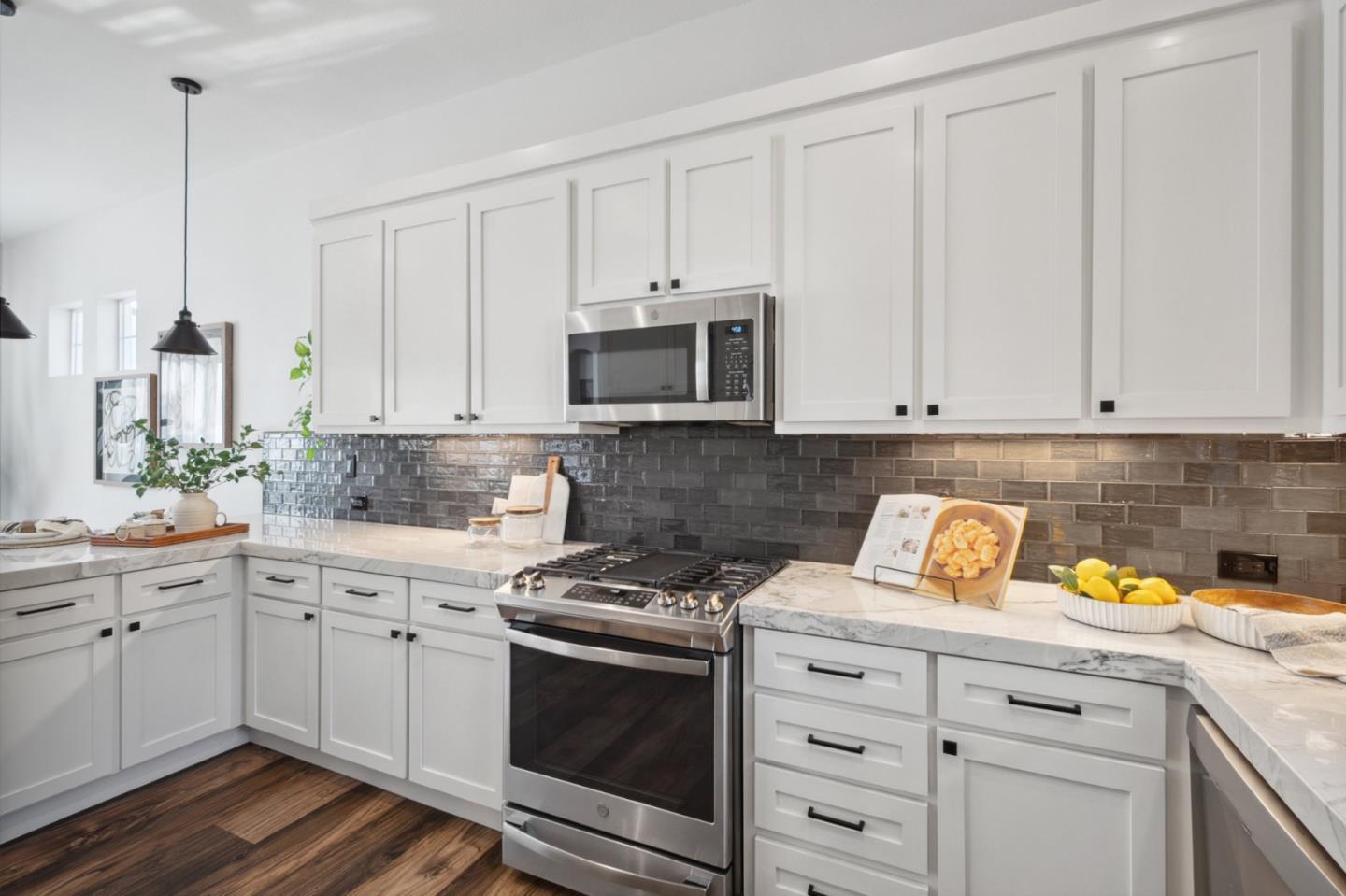 7531 Edinburgh Way Gilroy, CA 95020 - Photo 13 of 52 a kitchen with white cabinets and white appliances