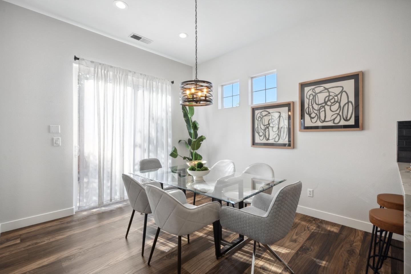 7531 Edinburgh Way Gilroy, CA 95020 - Photo 17 of 52 a view of a dining room with furniture window and wooden floor