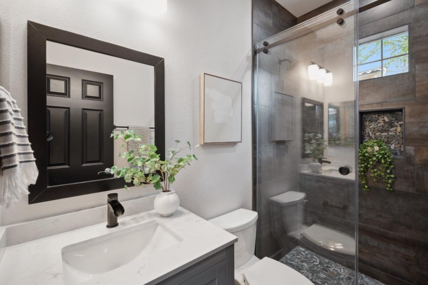 7531 Edinburgh Way Gilroy, CA 95020 - Photo 19 of 52 a bathroom with a sink toilet and shower