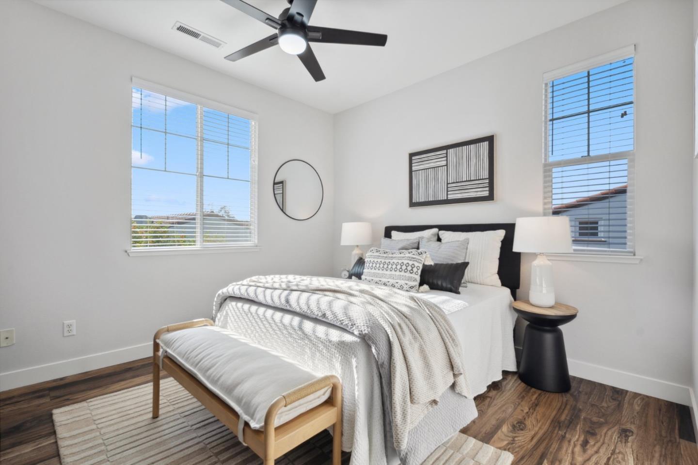 7531 Edinburgh Way Gilroy, CA 95020 - Photo 32 of 52 a bedroom with a bed and wooden floor