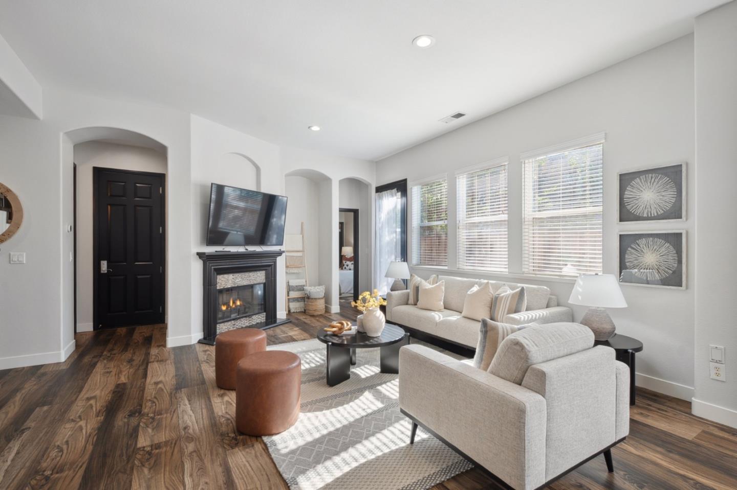 7531 Edinburgh Way Gilroy, CA 95020 - Photo 8 of 52 a living room with furniture and a fireplace