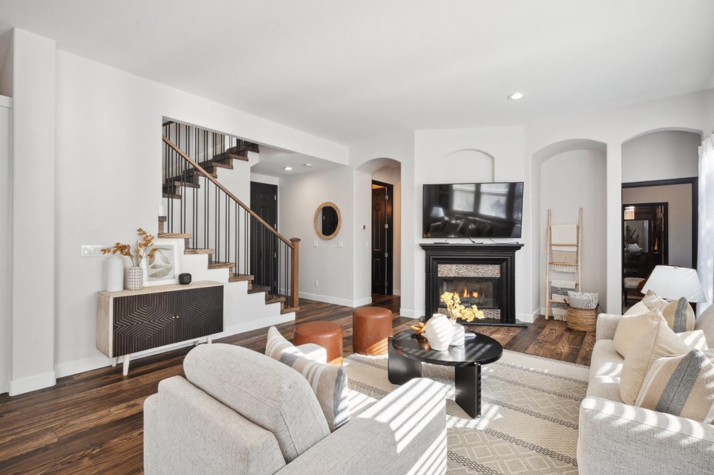 7531 Edinburgh Way Gilroy, CA 95020 - Photo 9 of 52 a living room with furniture and a fireplace