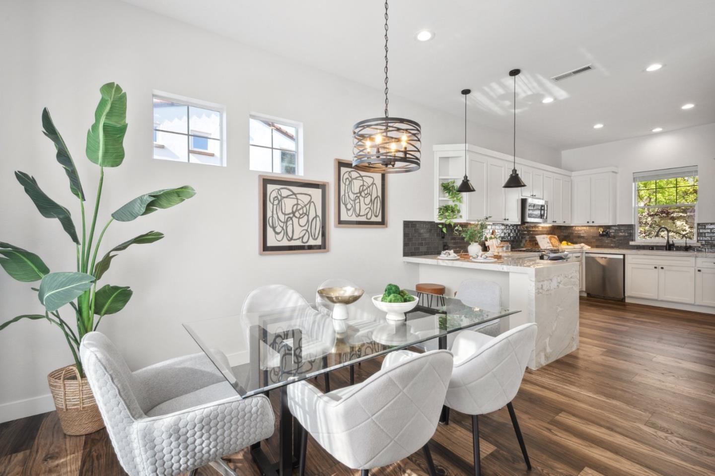 7531 Edinburgh Way Gilroy, CA 95020 - Photo 10 of 52 a dining room filled chandelier and wooden floor