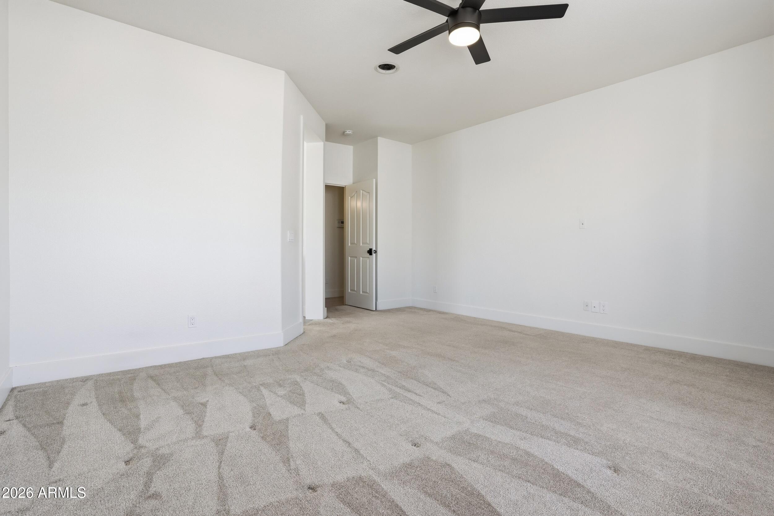 3262 East Cotton Lane Gilbert, AZ 85234 - Photo 20 of 53 a view of a room with a ceiling fan