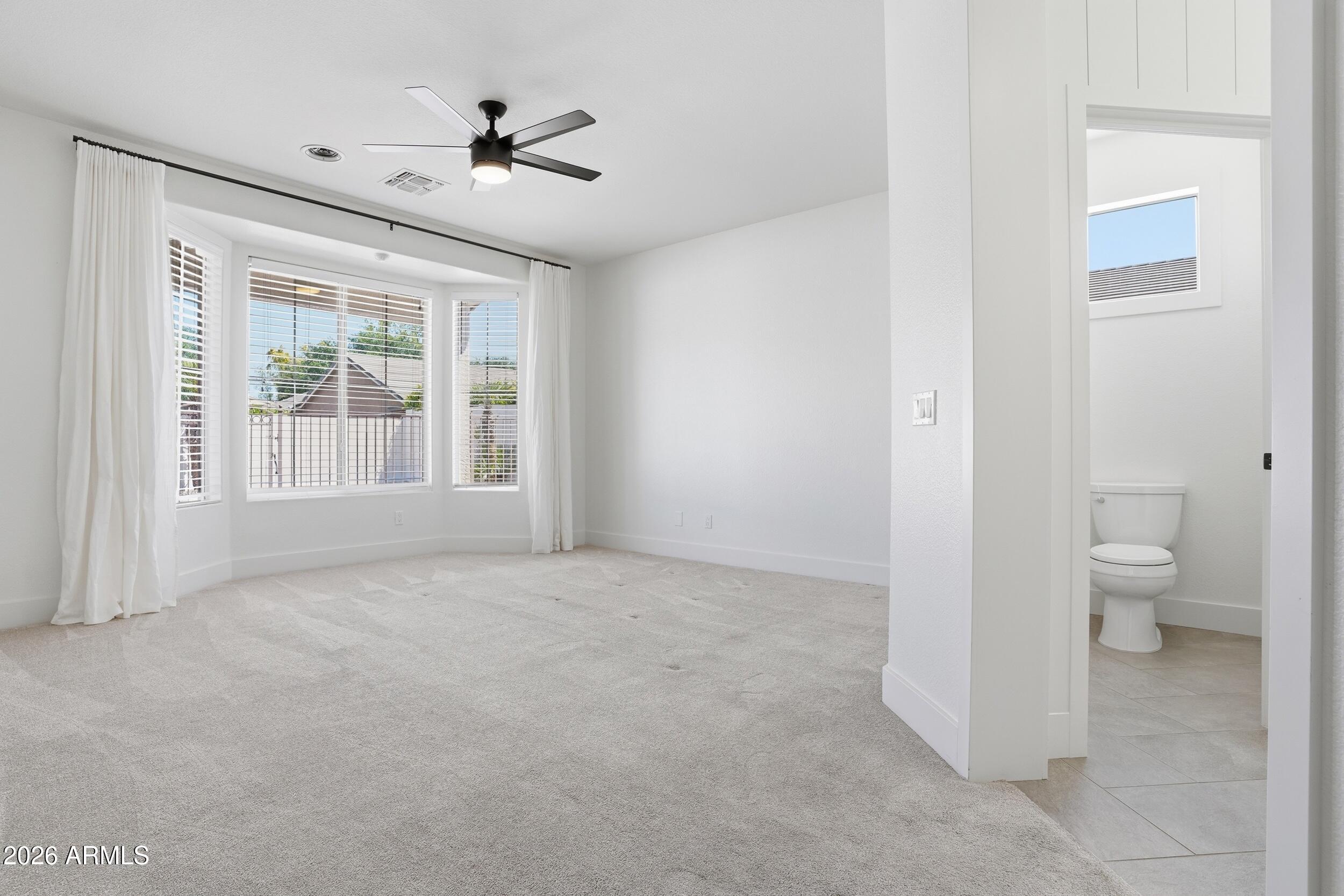3262 East Cotton Lane Gilbert, AZ 85234 - Photo 21 of 53 a view of an empty room with a window