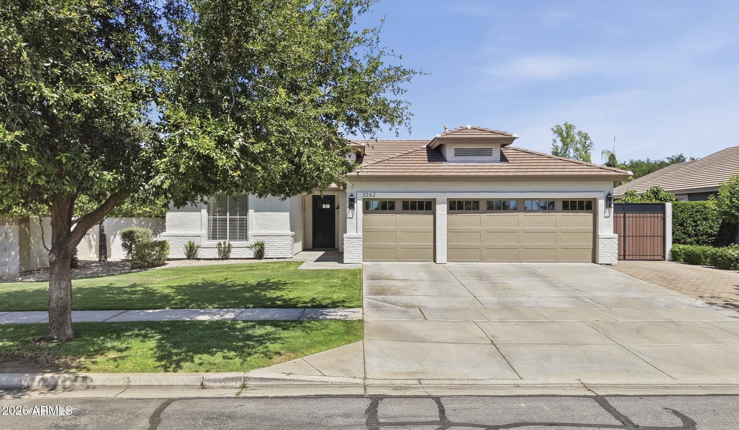 3262 East Cotton Lane Gilbert, AZ 85234 - Photo 2 of 53 front view of a house with a yard