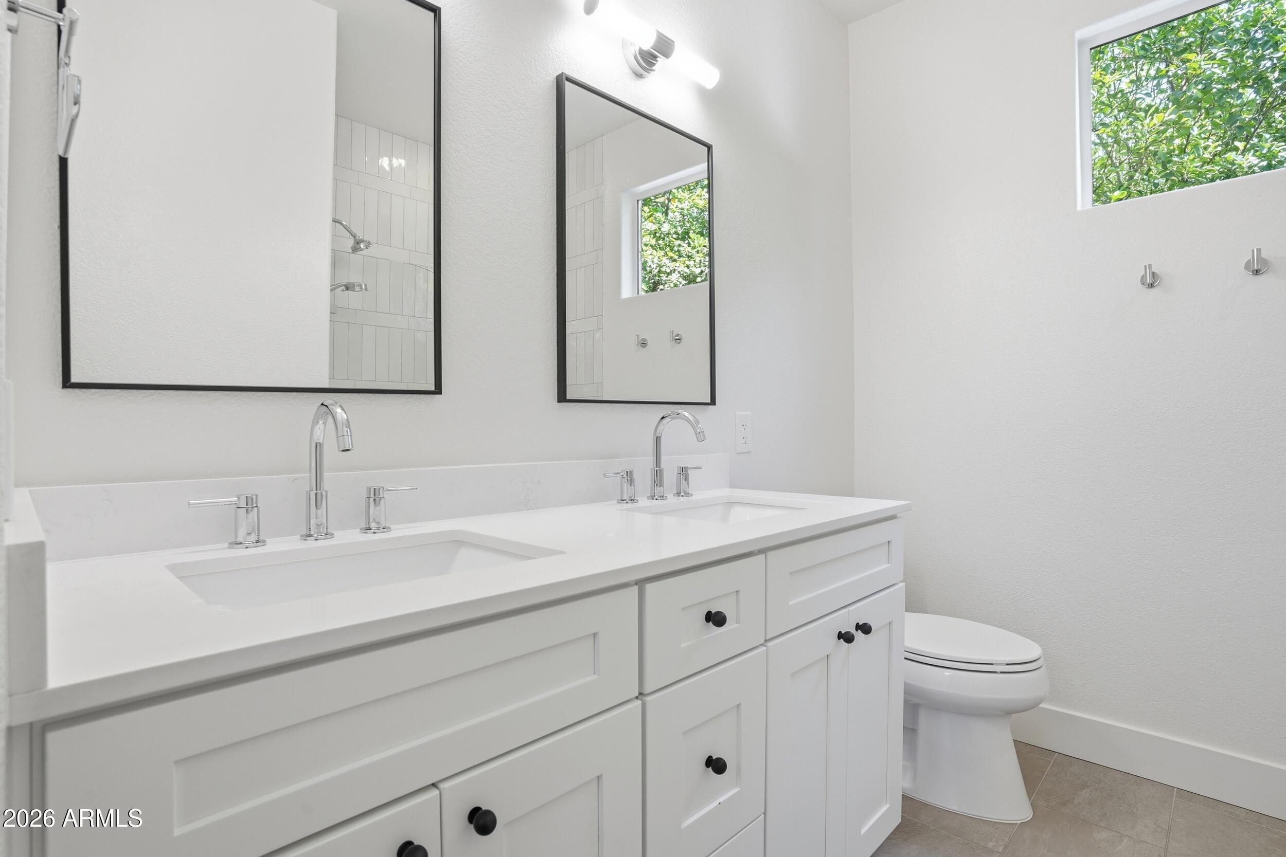 3262 East Cotton Lane Gilbert, AZ 85234 - Photo 31 of 53 a bathroom with a toilet sink and mirror