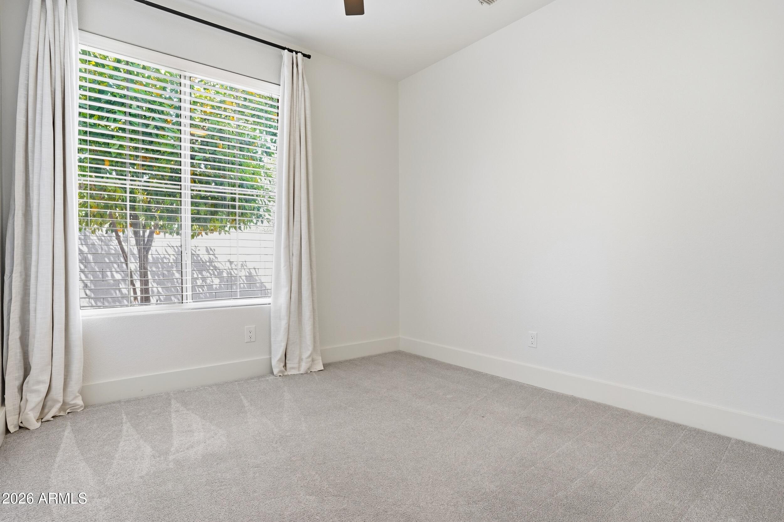 3262 East Cotton Lane Gilbert, AZ 85234 - Photo 33 of 53 a view of an empty room with a window