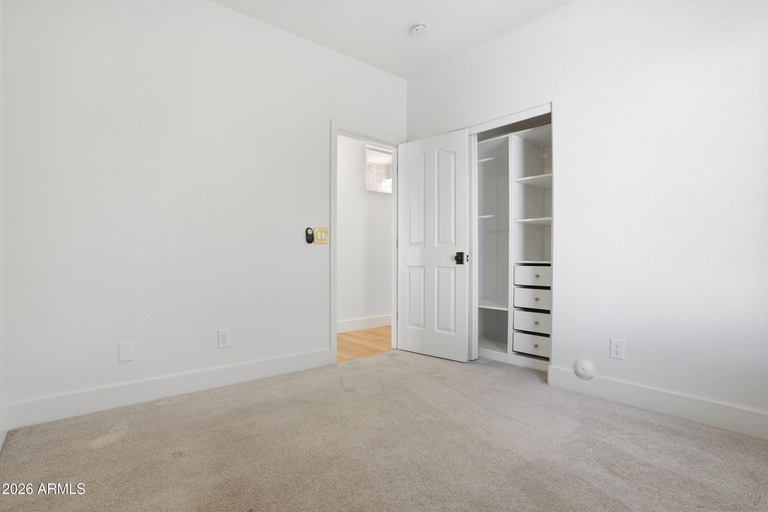 3262 East Cotton Lane Gilbert, AZ 85234 - Photo 34 of 53 a view of room with walk in closet and window