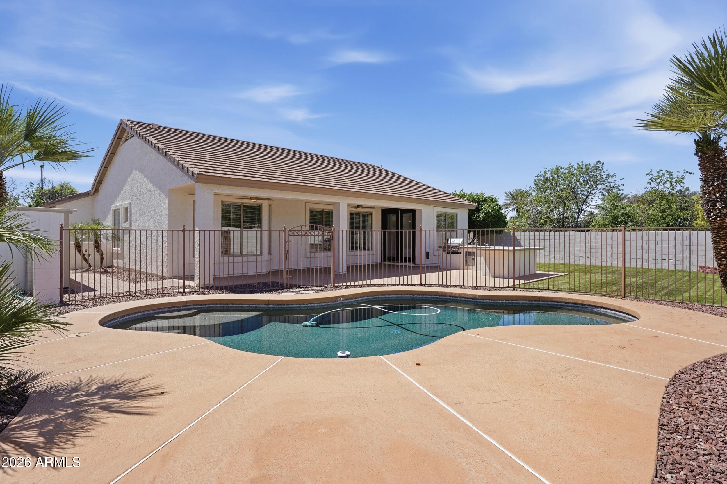 3262 East Cotton Lane Gilbert, AZ 85234 - Photo 38 of 53 a view of a house with swimming pool and sitting area