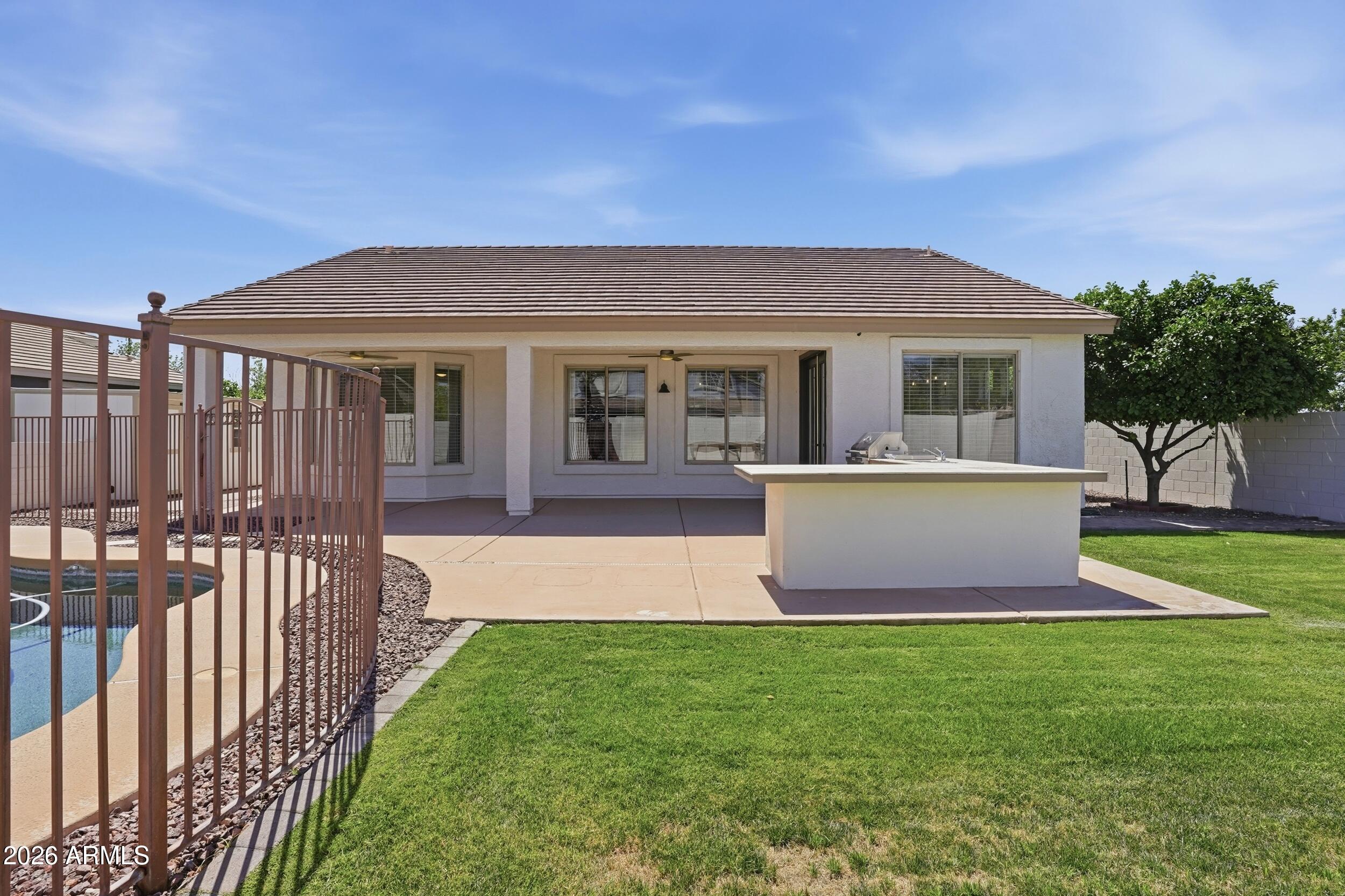 3262 East Cotton Lane Gilbert, AZ 85234 - Photo 39 of 53 a front view of house with yard and green space