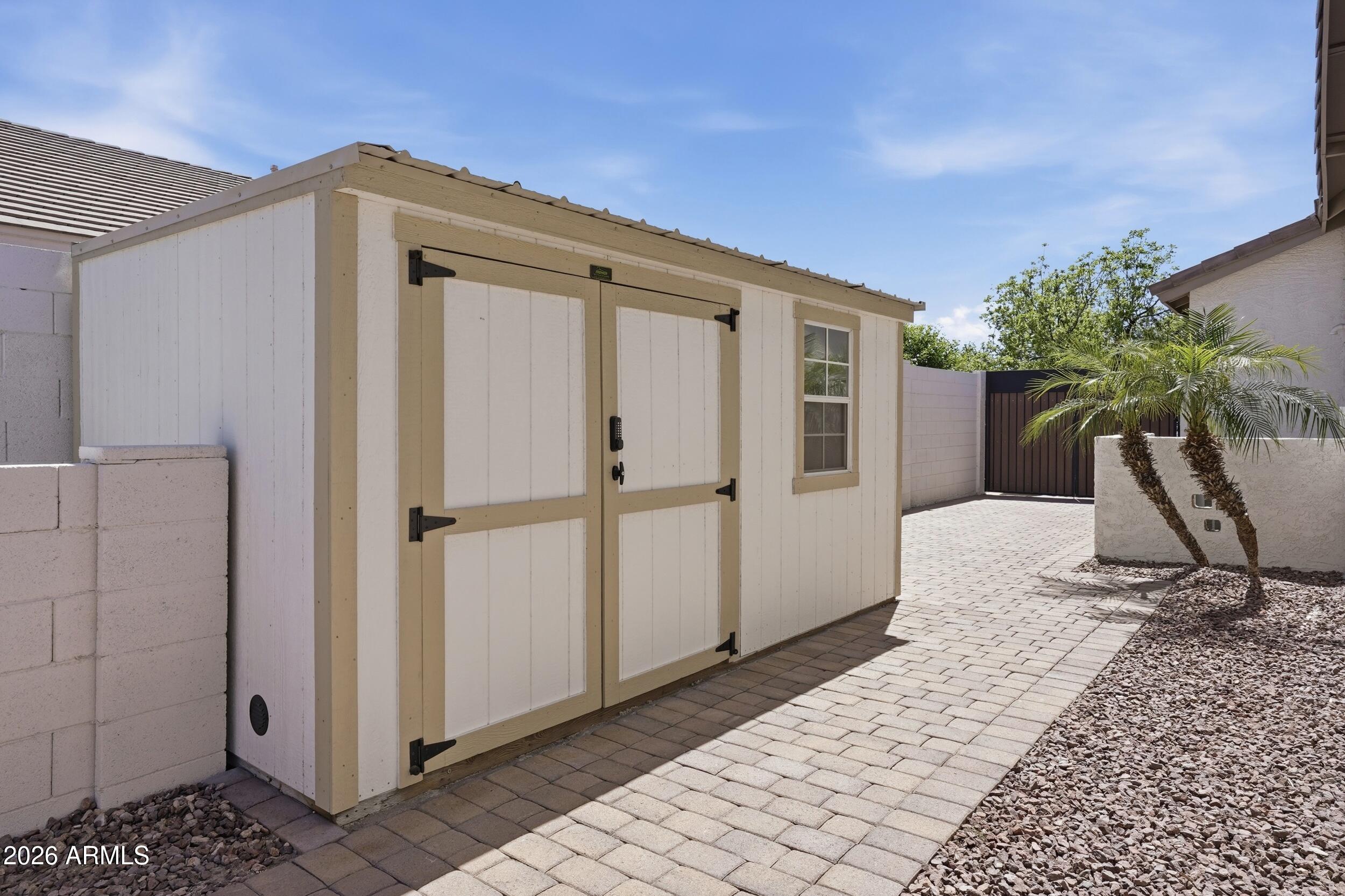 3262 East Cotton Lane Gilbert, AZ 85234 - Photo 45 of 53 a view of a house with backyard and sitting area