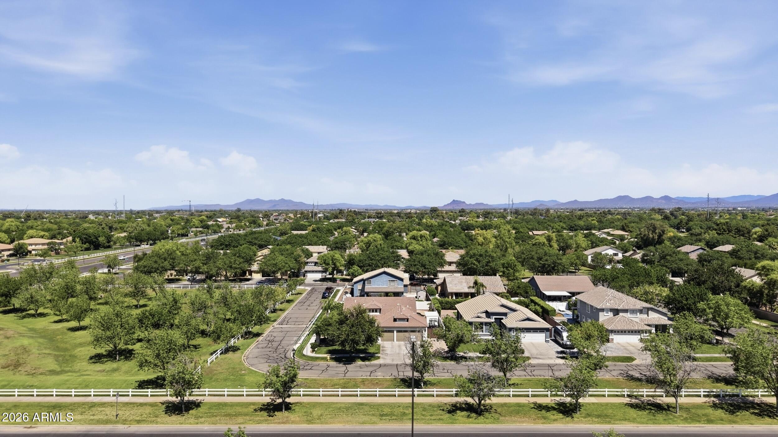 3262 East Cotton Lane Gilbert, AZ 85234 - Photo 47 of 53 an aerial view of residential houses with outdoor space