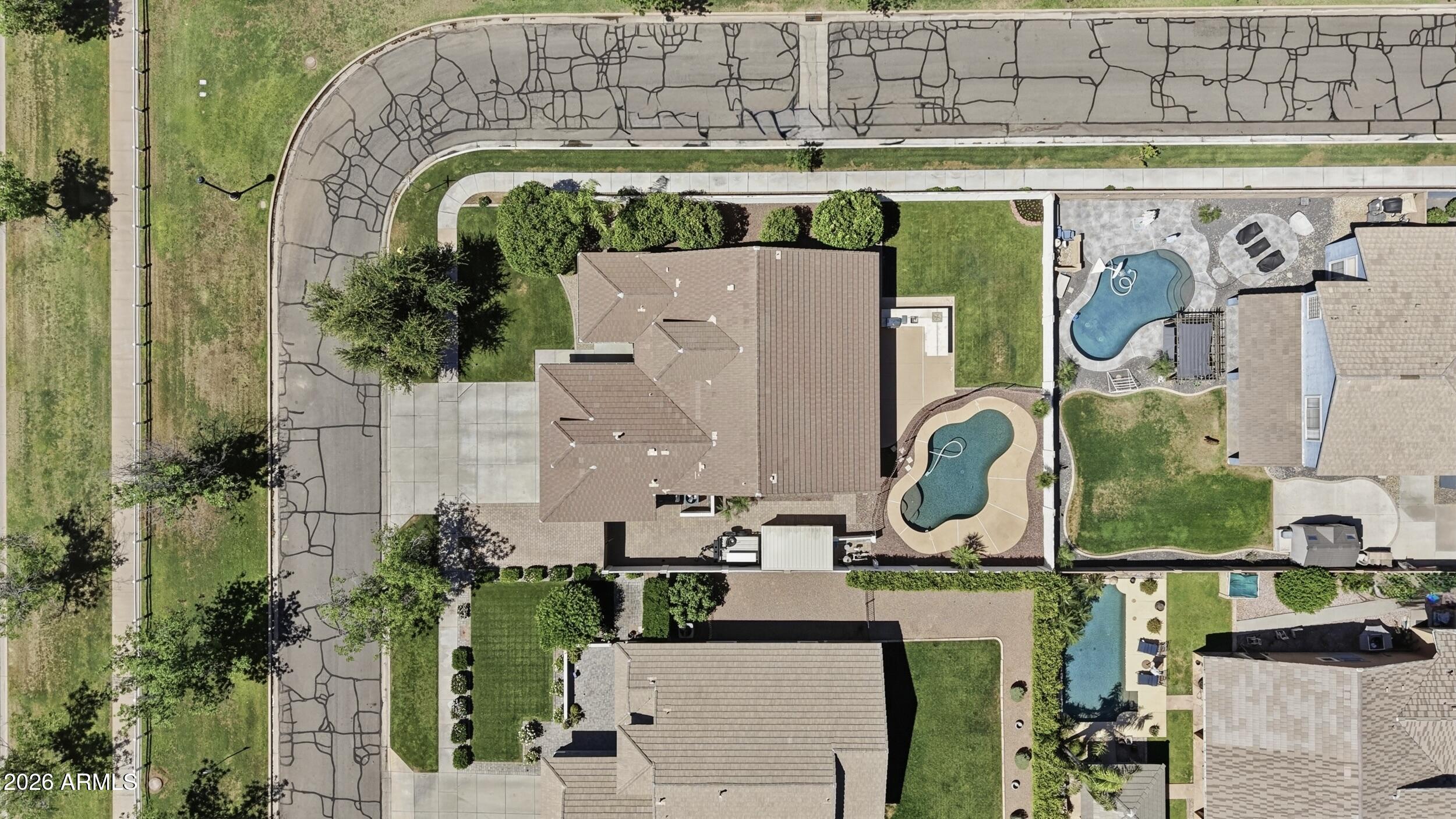 3262 East Cotton Lane Gilbert, AZ 85234 - Photo 49 of 53 an aerial view of a house with a swimming pool