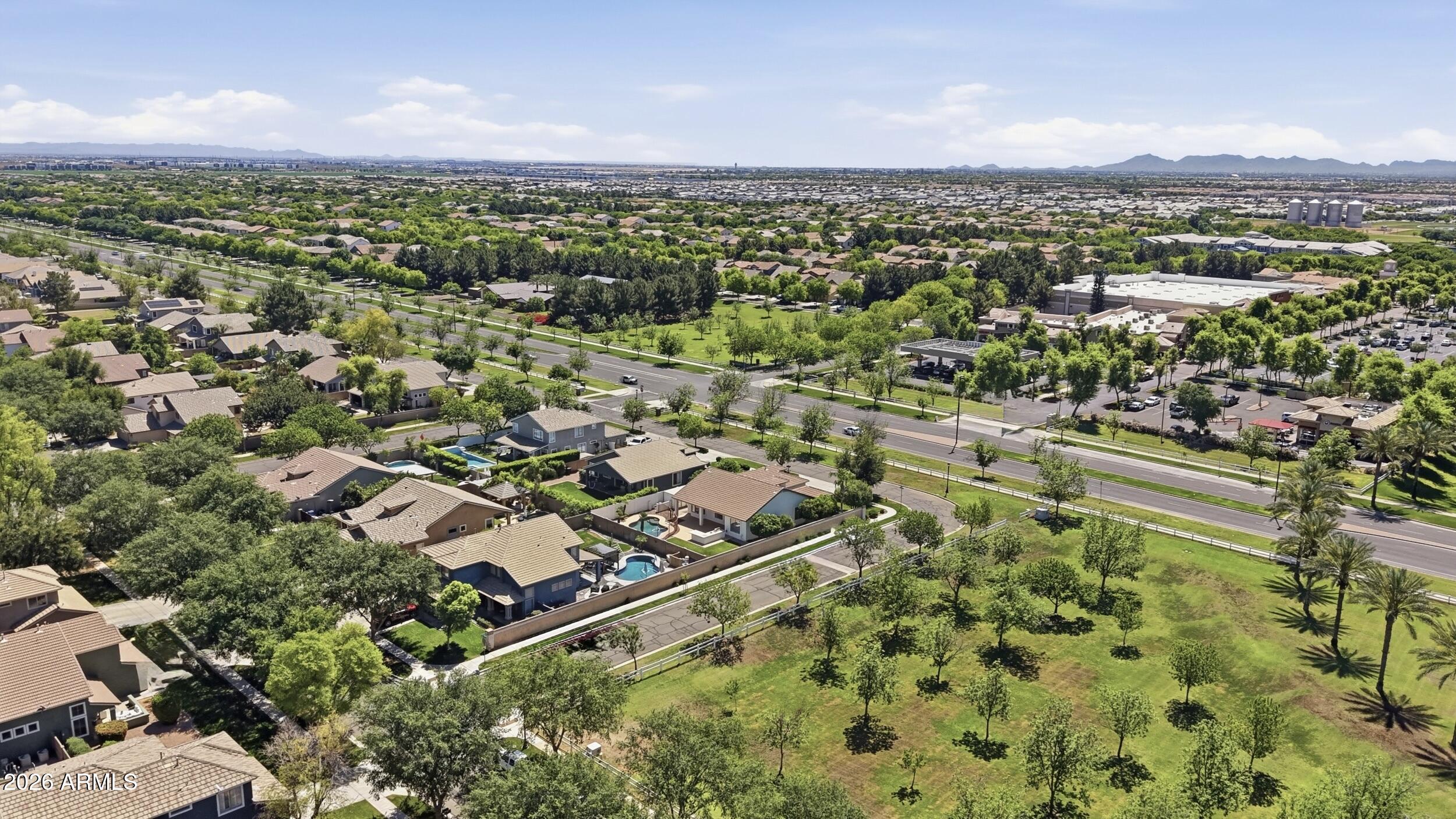 3262 East Cotton Lane Gilbert, AZ 85234 - Photo 50 of 53 an aerial view of residential houses with outdoor space and trees
