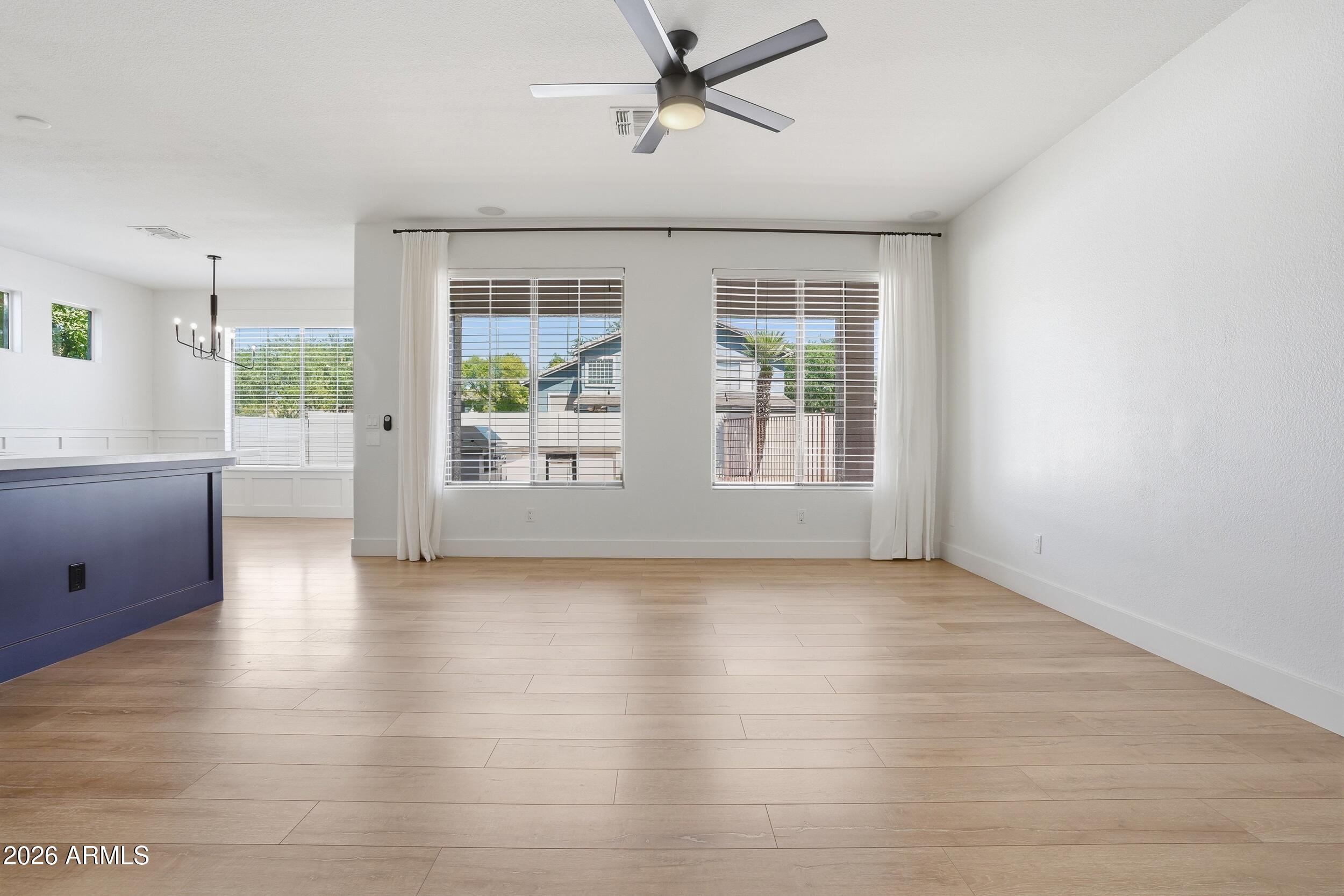 3262 East Cotton Lane Gilbert, AZ 85234 - Photo 8 of 53 a view of an empty room with a window