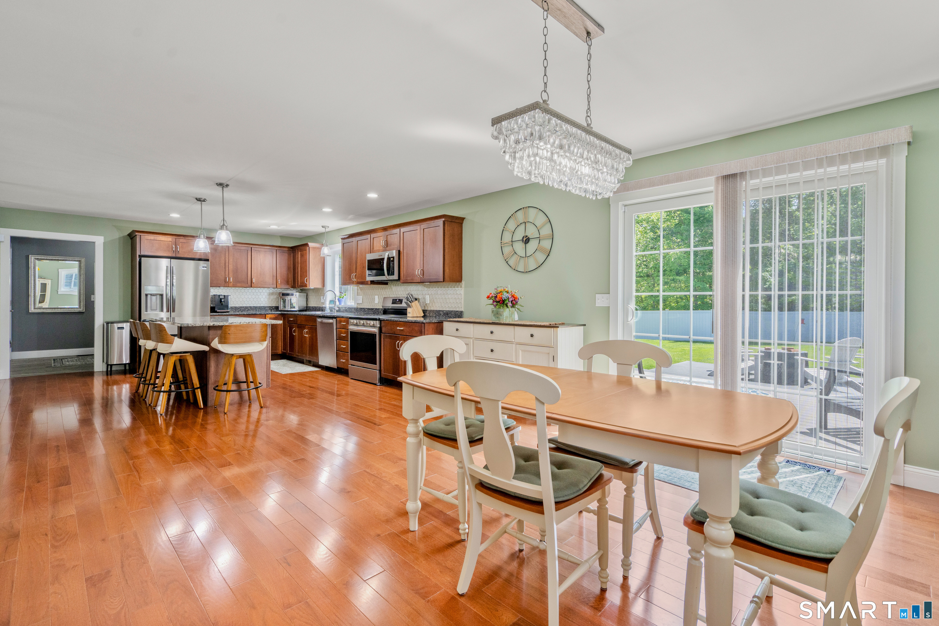 5 Limric Lane Suffield, CT 06078 - Photo 12 of 36 a view of a dining room with furniture window and wooden floor