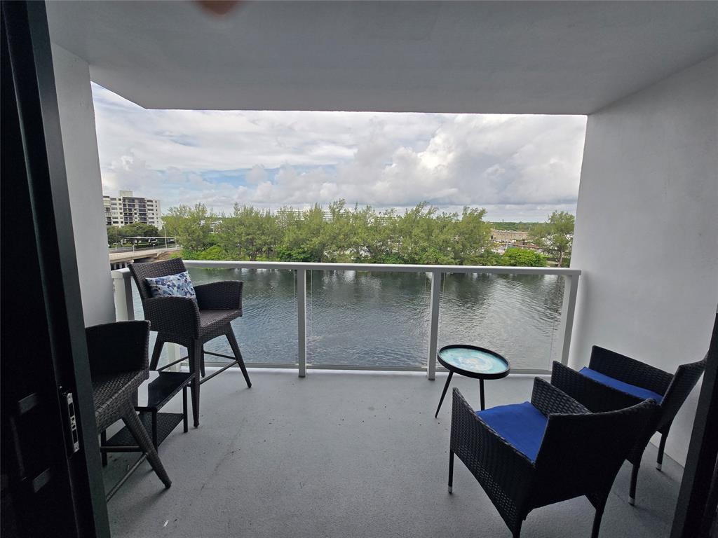 1401 North Riverside Drive, Unit 705 Pompano Beach, FL 33062 - Photo 1 of 30 a view of a chairs and table in the balcony