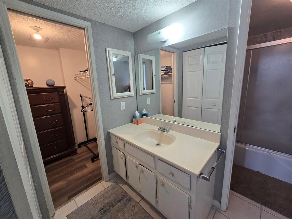 1401 North Riverside Drive, Unit 705 Pompano Beach, FL 33062 - Photo 11 of 30 a bathroom with a sink a mirror and a shower
