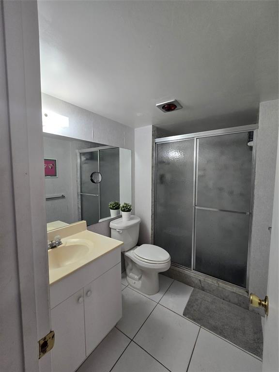 1401 North Riverside Drive, Unit 705 Pompano Beach, FL 33062 - Photo 15 of 30 a bathroom with a double vanity sink toilet and shower
