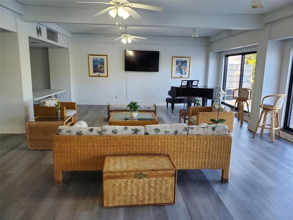 1401 North Riverside Drive, Unit 705 Pompano Beach, FL 33062 - Photo 22 of 30 a living room with furniture and a flat screen tv